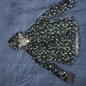 A Christmas sweater from No Boundaries, size large, has a mix of colors